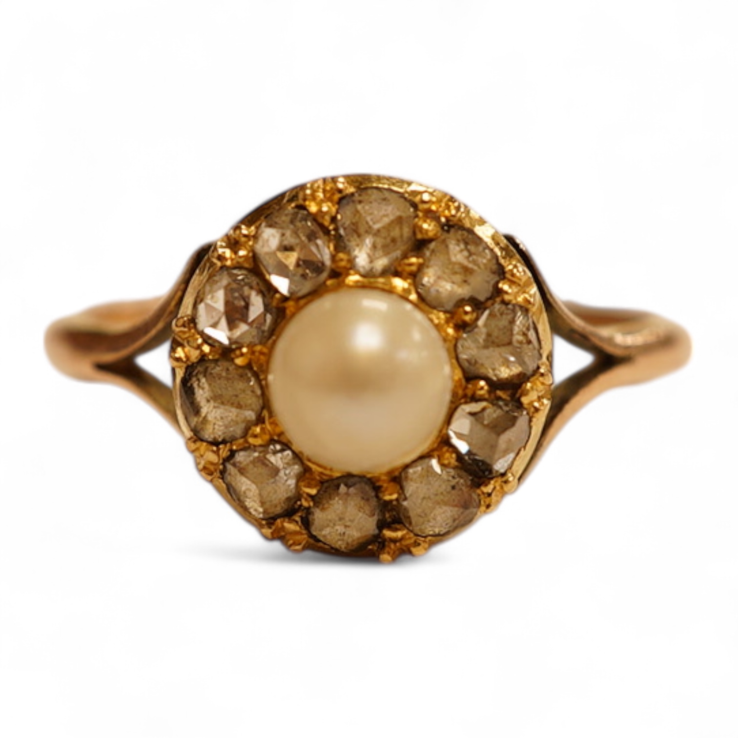 An early 20th century 9ct, cultured pearl and rose cut diamond set circular cluster ring, size O, gross weight 2.8 grams.